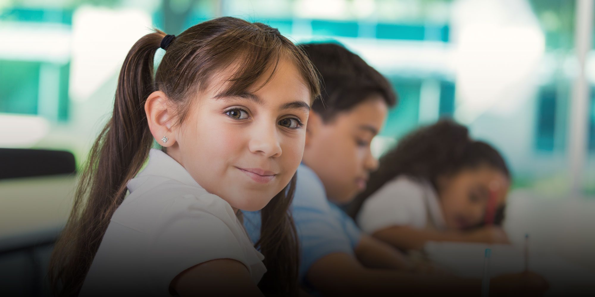 Smiling student working at desk